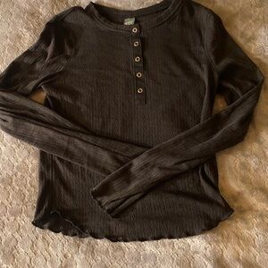 Super cute crocheted type cropped long sleeve shirt, in size medium.